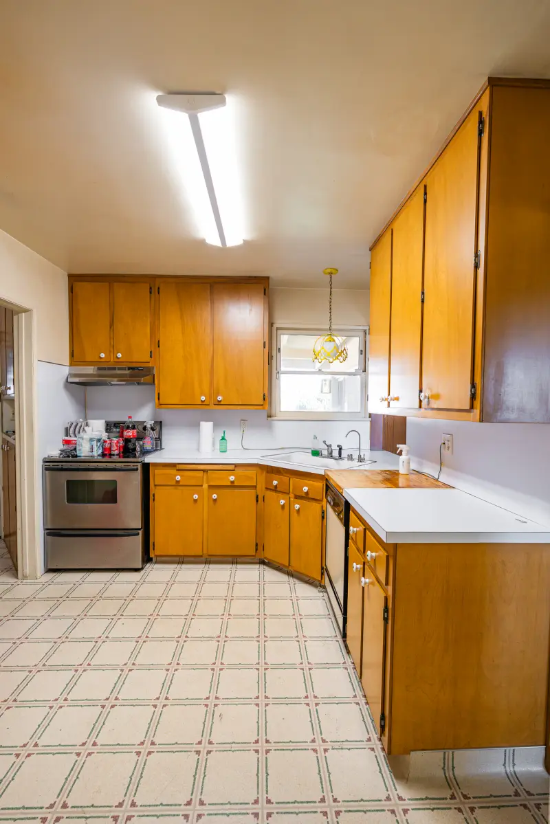 Kitchen with range, sink and wood cabinets